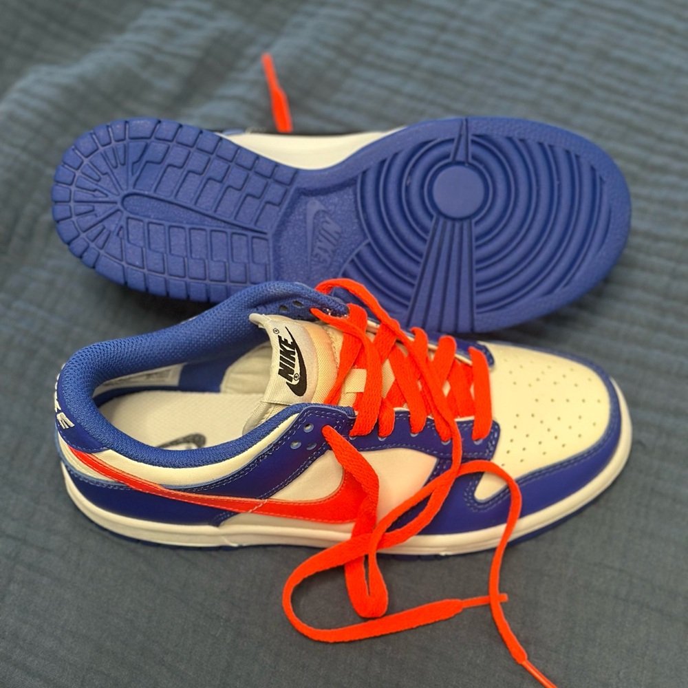 Nike White and Blue Sneakers with orange Accents - Picture 2 of 3